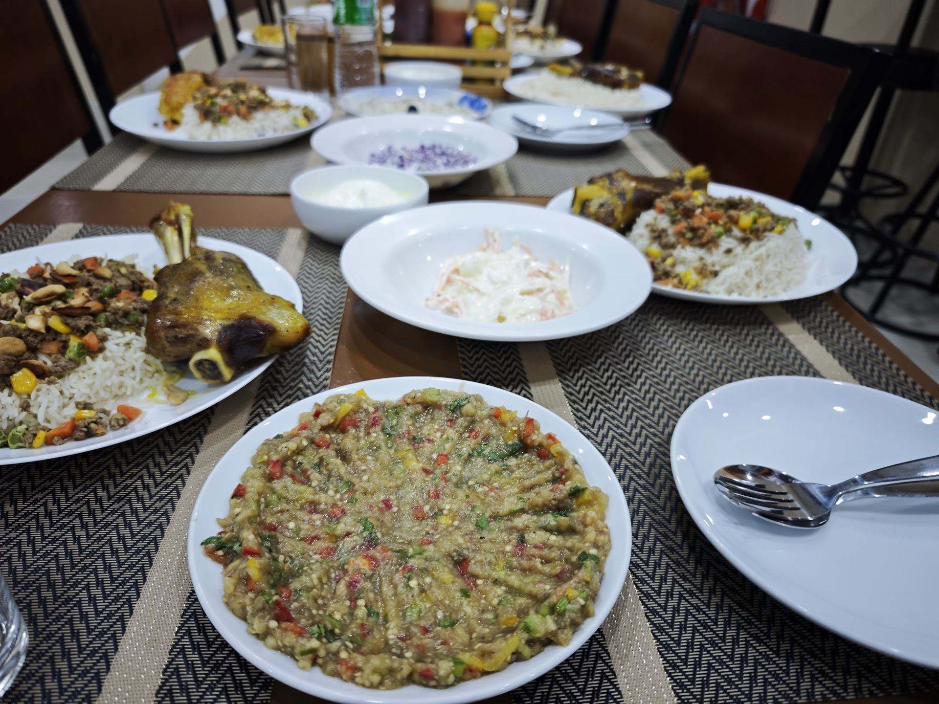 A Palestinian ozi dinner spread with a variety of salads